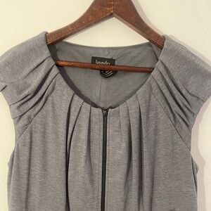 Black and grey dress. Top is soft grey with zipper down the front.
